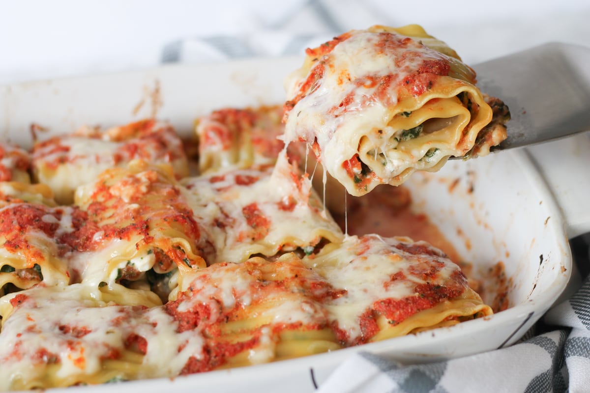 Lasagna roll ups with cottage cheese and spinach in casserole dish