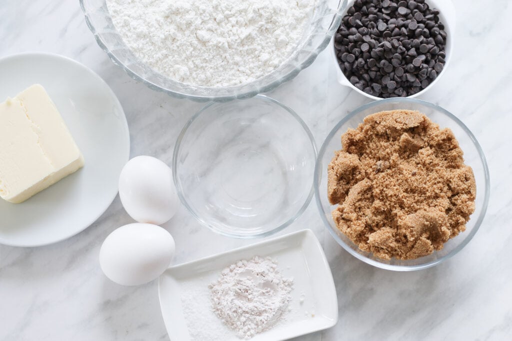 Ingredients for biscotti on marble countertop.